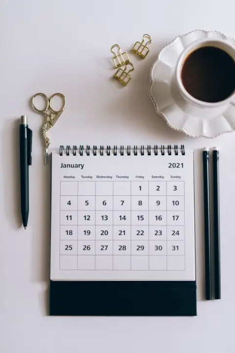 A desk calendar and pen
